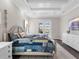 Spacious bedroom with a king-size bed and pool view at 8050 Redonda Loop, Lakewood Ranch, FL 34202