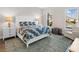 Comfortable bedroom with a queen-size bed and large windows at 8050 Redonda Loop, Lakewood Ranch, FL 34202