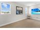 Bright bonus room with large windows and a comfortable chair at 8050 Redonda Loop, Lakewood Ranch, FL 34202