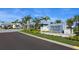 The Isles at Lakewood Ranch entrance with palm trees and signage at 8050 Redonda Loop, Lakewood Ranch, FL 34202