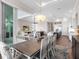 Open dining room with view into the kitchen and living areas at 8050 Redonda Loop, Lakewood Ranch, FL 34202