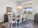 Elegant dining room featuring a large table and hardwood floors at 8050 Redonda Loop, Lakewood Ranch, FL 34202