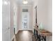 Bright foyer with wood flooring and decorative console table at 8050 Redonda Loop, Lakewood Ranch, FL 34202