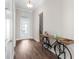 Bright foyer with wood flooring and decorative console table at 8050 Redonda Loop, Lakewood Ranch, FL 34202