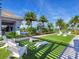 Artificial turf lawn with cornhole and seating at 8050 Redonda Loop, Lakewood Ranch, FL 34202