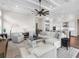 Spacious living room with sectional sofa, fireplace, and hardwood floors at 8050 Redonda Loop, Lakewood Ranch, FL 34202