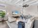 Bright living room featuring a large TV and comfortable seating at 8050 Redonda Loop, Lakewood Ranch, FL 34202