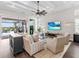 Spacious living room with coffered ceiling, sliding doors to lanai at 8050 Redonda Loop, Lakewood Ranch, FL 34202