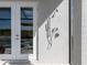 Convenient outdoor shower with double doors adjacent to the pool at 8050 Redonda Loop, Lakewood Ranch, FL 34202