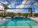 Inviting pool and spa with a covered patio at 8050 Redonda Loop, Lakewood Ranch, FL 34202