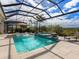 Resort-style pool and spa with covered patio at 8050 Redonda Loop, Lakewood Ranch, FL 34202