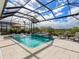 Relaxing pool and spa with covered patio and lounge chairs at 8050 Redonda Loop, Lakewood Ranch, FL 34202