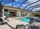 Spacious pool and patio area with covered lanai and outdoor seating at 8050 Redonda Loop, Lakewood Ranch, FL 34202