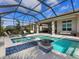 Stunning pool and spa with covered lanai and outdoor kitchen at 8050 Redonda Loop, Lakewood Ranch, FL 34202