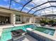Inviting pool and spa with mosaic tile and fire feature at 8050 Redonda Loop, Lakewood Ranch, FL 34202