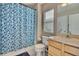 Bathroom with shower/tub combo and blue tile at 8238 72Nd St E, Bradenton, FL 34201