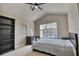 Bedroom with large window, built-in shelving and ceiling fan at 8238 72Nd St E, Bradenton, FL 34201