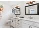 Double vanity bathroom with white cabinets and marble countertops at 8273 Annapolis Rd, Spring Hill, FL 34606