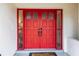 Eye-catching red double front doors with sidelights at 8273 Annapolis Rd, Spring Hill, FL 34606