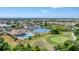 Aerial view of community with pool, tennis courts, and golf course at 8282 Parkside Dr, Englewood, FL 34224