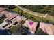 Bird's-eye view of a house with a tile roof and a lush green lawn at 8282 Parkside Dr, Englewood, FL 34224