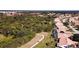 Aerial view of a community with houses, golf course, and lush green spaces at 8282 Parkside Dr, Englewood, FL 34224