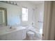 Bathroom with vanity, toilet and bathtub at 8282 Parkside Dr, Englewood, FL 34224