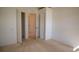 Bedroom with closet and carpet flooring at 8282 Parkside Dr, Englewood, FL 34224
