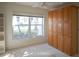 Bedroom with built-in shelves and window at 8282 Parkside Dr, Englewood, FL 34224