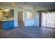 Open concept dining room with kitchen access and view of backyard at 8282 Parkside Dr, Englewood, FL 34224