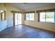Bright dining area with large windows and sliding glass doors leading to a patio at 8282 Parkside Dr, Englewood, FL 34224