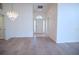 Bright and airy entryway with a chandelier and light-colored flooring at 8282 Parkside Dr, Englewood, FL 34224
