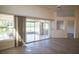 Open living space with sliding glass doors leading to a sunroom at 8282 Parkside Dr, Englewood, FL 34224