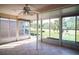 Bright and airy sunroom with tiled floors and a view of the backyard at 8282 Parkside Dr, Englewood, FL 34224