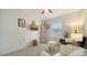 Cozy bedroom with seating area and large window at 8533 Lunar Skye St, Sarasota, FL 34241