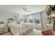 Primary bedroom with king bed and large windows at 8533 Lunar Skye St, Sarasota, FL 34241