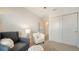 Spacious bedroom with comfortable seating and built-in closet at 8533 Lunar Skye St, Sarasota, FL 34241