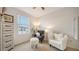Serene bedroom with two armchairs and dresser at 8533 Lunar Skye St, Sarasota, FL 34241