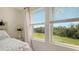 Bright bedroom with large windows offering a tranquil view at 8533 Lunar Skye St, Sarasota, FL 34241