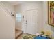 Bright entryway with staircase, interior door and rugs at 8533 Lunar Skye St, Sarasota, FL 34241