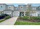 Two-story townhome with attached garage and manicured landscaping at 8533 Lunar Skye St, Sarasota, FL 34241