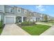 Two-story townhome with attached garage and landscaped front yard at 8533 Lunar Skye St, Sarasota, FL 34241