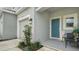 Teal front door, landscaping, and attached garage visible at 8533 Lunar Skye St, Sarasota, FL 34241
