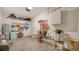 Organized garage with overhead storage, cabinets, and ample floor space at 8533 Lunar Skye St, Sarasota, FL 34241