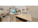 Modern kitchen island with white cabinets and quartz countertops at 8533 Lunar Skye St, Sarasota, FL 34241