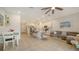 Open living and kitchen area with tile floors and patio access at 8533 Lunar Skye St, Sarasota, FL 34241