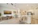 Open concept living space with kitchen island and dining area at 8533 Lunar Skye St, Sarasota, FL 34241
