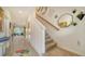 Modern staircase with decorative wall art and light flooring at 8533 Lunar Skye St, Sarasota, FL 34241
