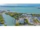 Aerial view of waterfront community with lush landscaping and private boat docks at 888 S Orange Ave # 3D, Sarasota, FL 34236
