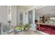 Private balcony with seating and potted plants, overlooking living room at 888 S Orange Ave # 3D, Sarasota, FL 34236